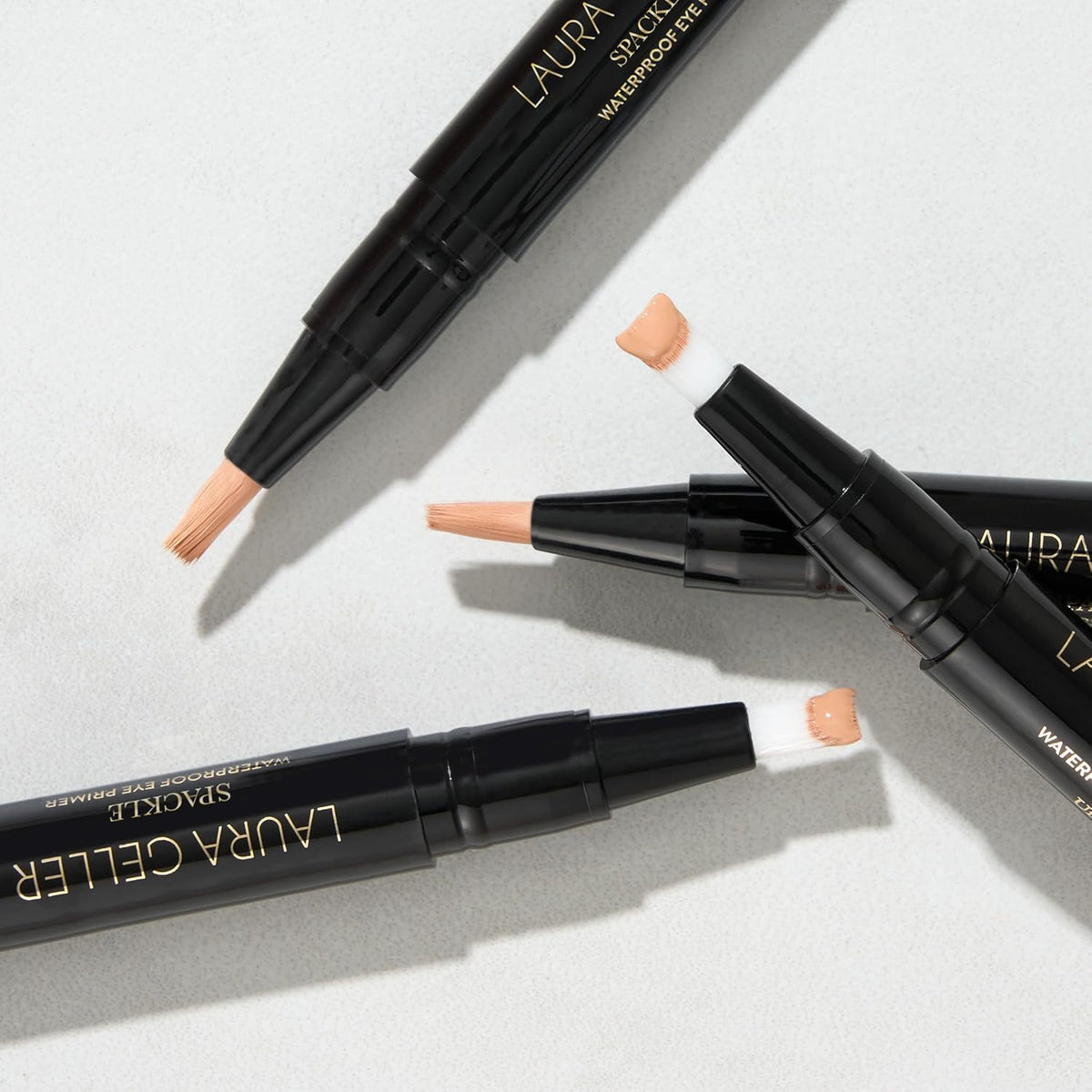 LAURA GELLER NEW YORK on a vanity with brushes showing everyday routine and polished results