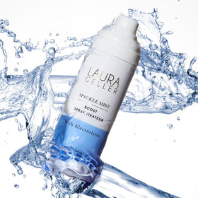 LAURA GELLER lifestyle image by laptop demonstrating blue light protection benefit