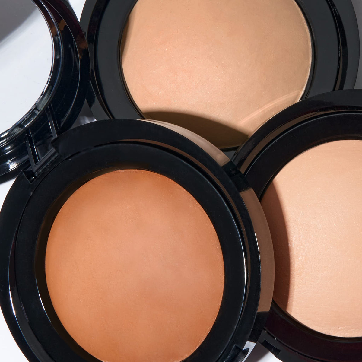 LAURA GELLER lifestyle mirror shot demonstrating natural matte look and photo-ready benefit