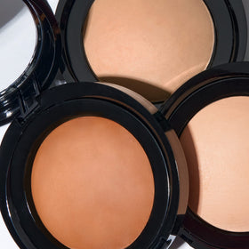 LAURA GELLER lifestyle mirror shot demonstrating natural matte look and photo-ready benefit