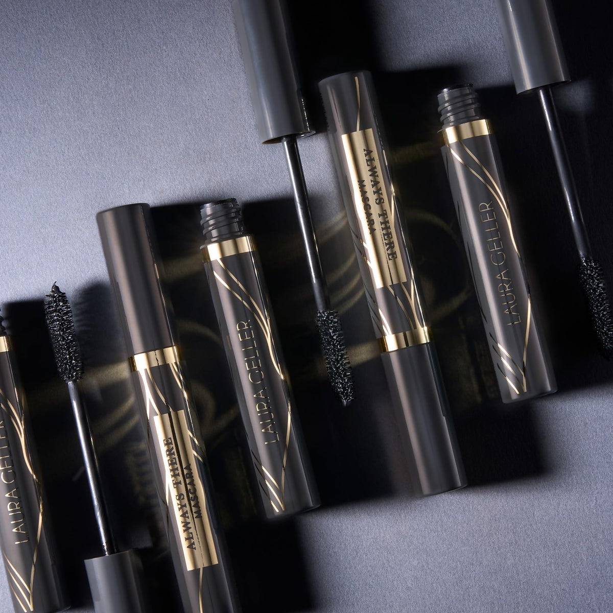 LAURA GELLER NEW YORK mascara in hand for size and scale, easy-to-use benefit