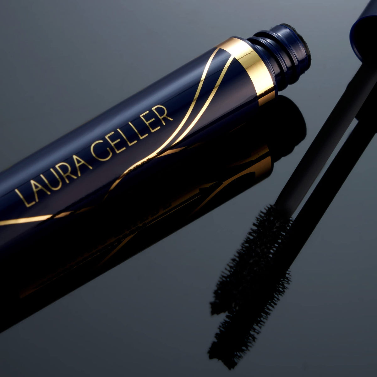 LAURA GELLER NEW YORK lifestyle model applying mascara to show natural dramatic effect