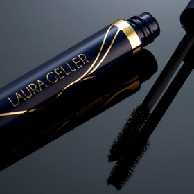 LAURA GELLER NEW YORK lifestyle model applying mascara to show natural dramatic effect