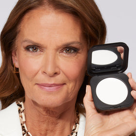 LAURA GELLER NEW YORK close-up texture of finely milled powder for blur and matte effect