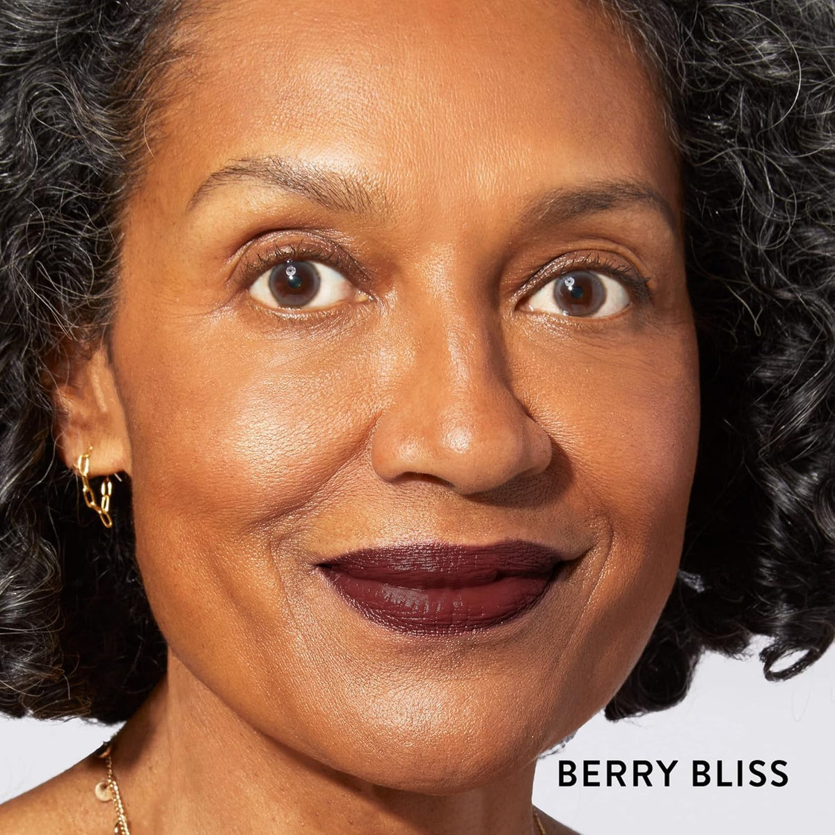 LAURA GELLER NEW YORK open lipstick twisted up to show Berry Bliss bullet for easy application