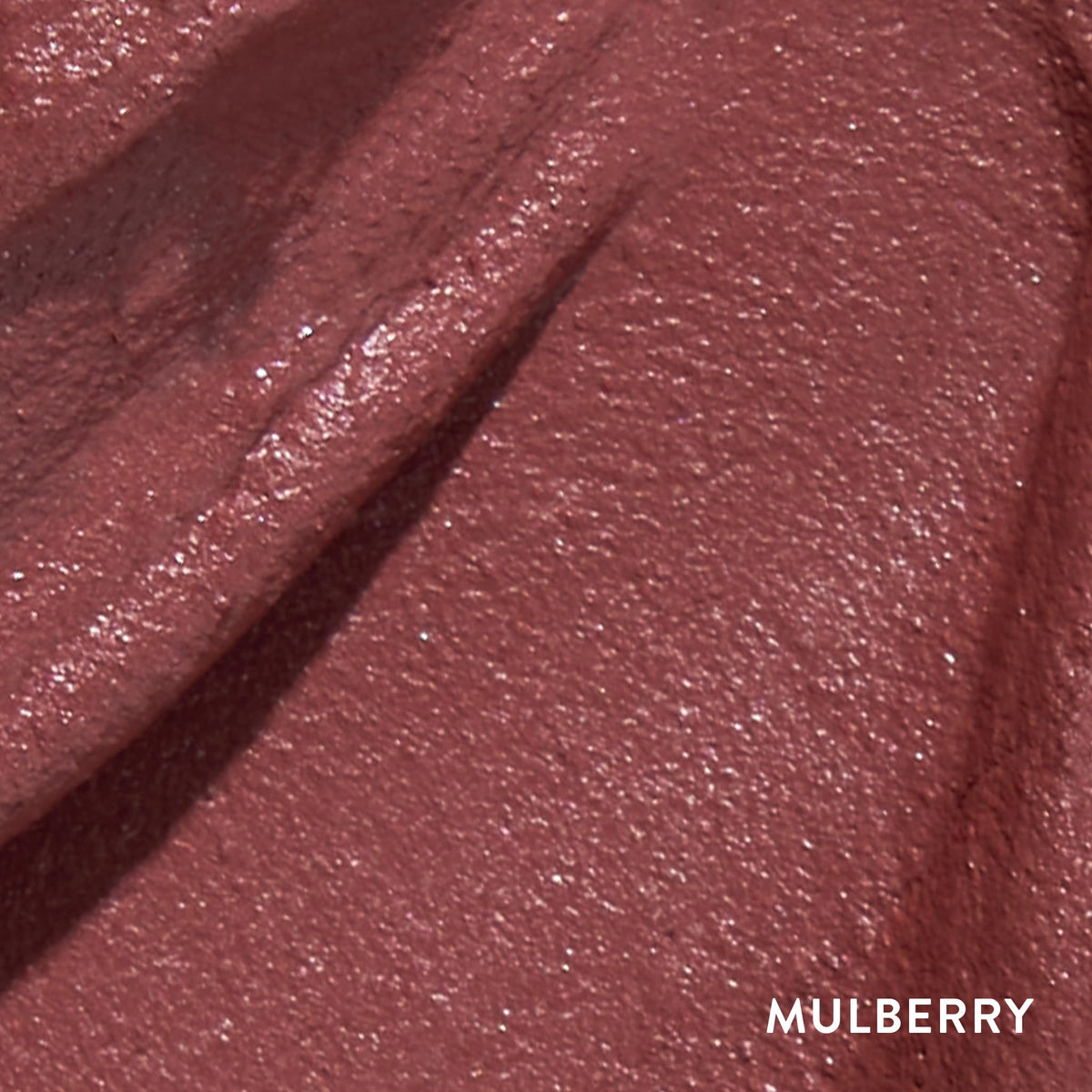 LAURA GELLER NEW YORK Mulberry swatches on hand and lips showing longwear matte benefit