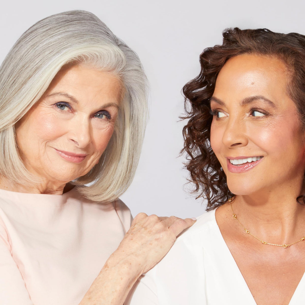 LAURA GELLER NEW YORK brush picking up product for precise, buildable highlight
