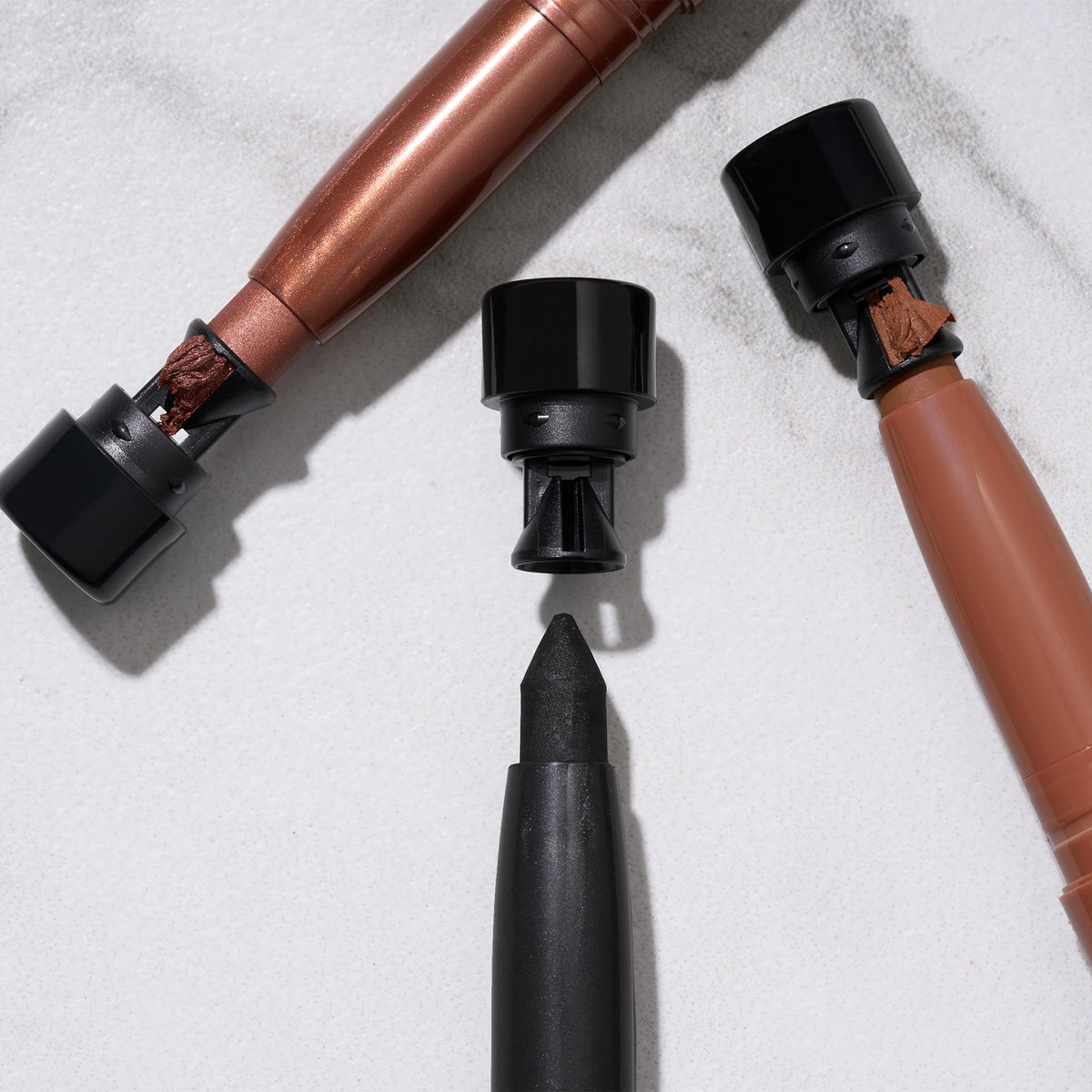 LAURA GELLER NEW YORK pencils held in hand to show scale and portable convenience
