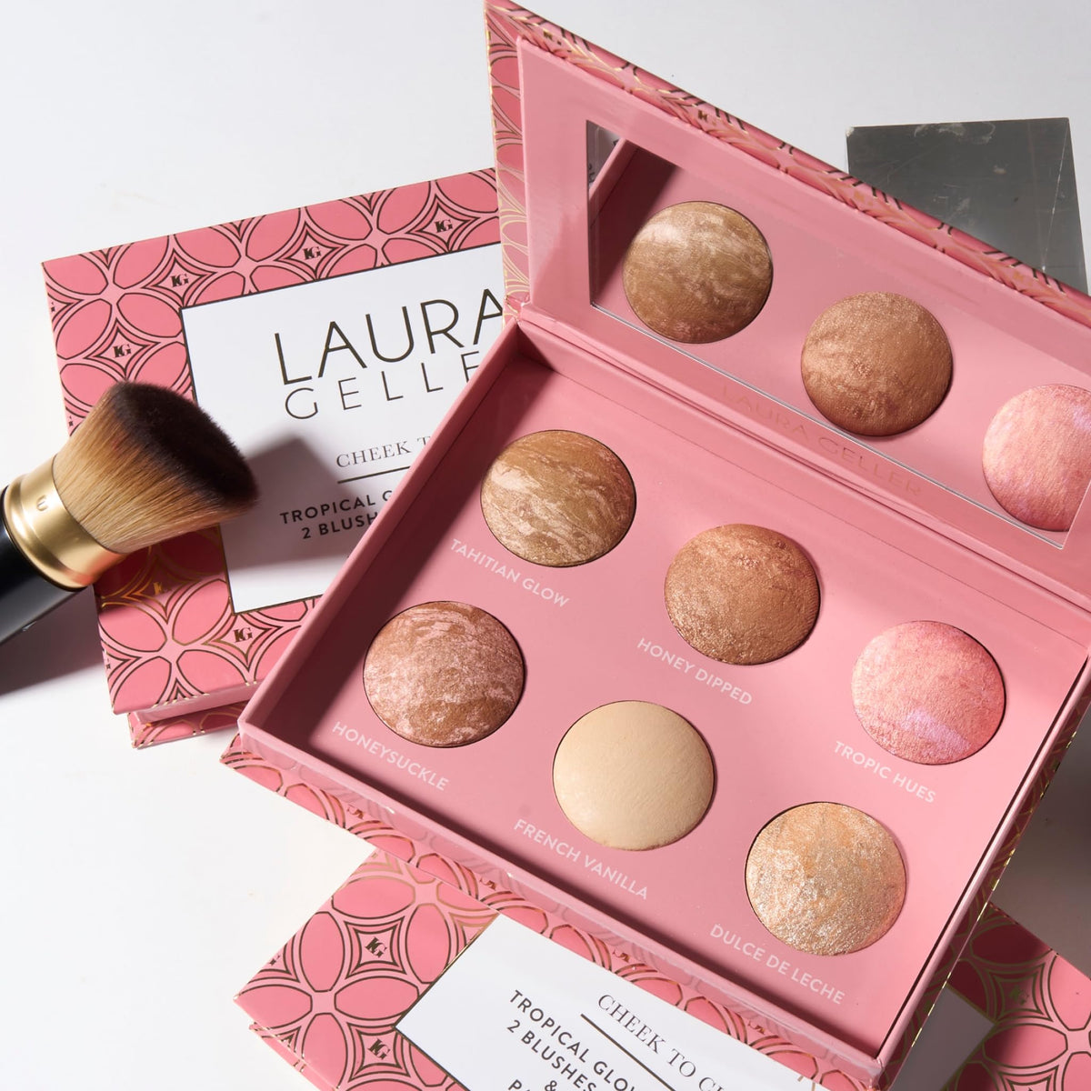 LAURA GELLER NEW YORK palette in hand showing compact travel-friendly size and convenience