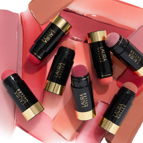 LAURA GELLER NEW YORK size comparison in hand to show portable convenience