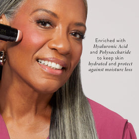 LAURA GELLER NEW YORK blended swatch on skin showing sheer watercolor finish
