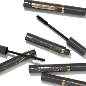 LAURA GELLER NEW YORK opened tube showing creamy formula ready for layering benefits