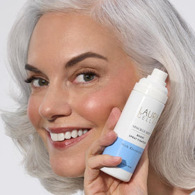 LAURA GELLER product held in hand to show size and portability benefit