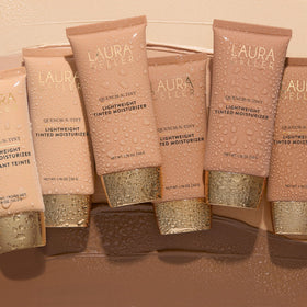 LAURA GELLER NEW YORK lifestyle on vanity demonstrating everyday hydrating glow