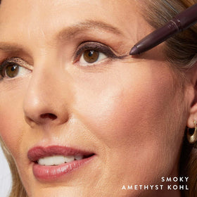 LAURA GELLER NEW YORK single-arm swatch showing rich Smoky Amethyst payoff