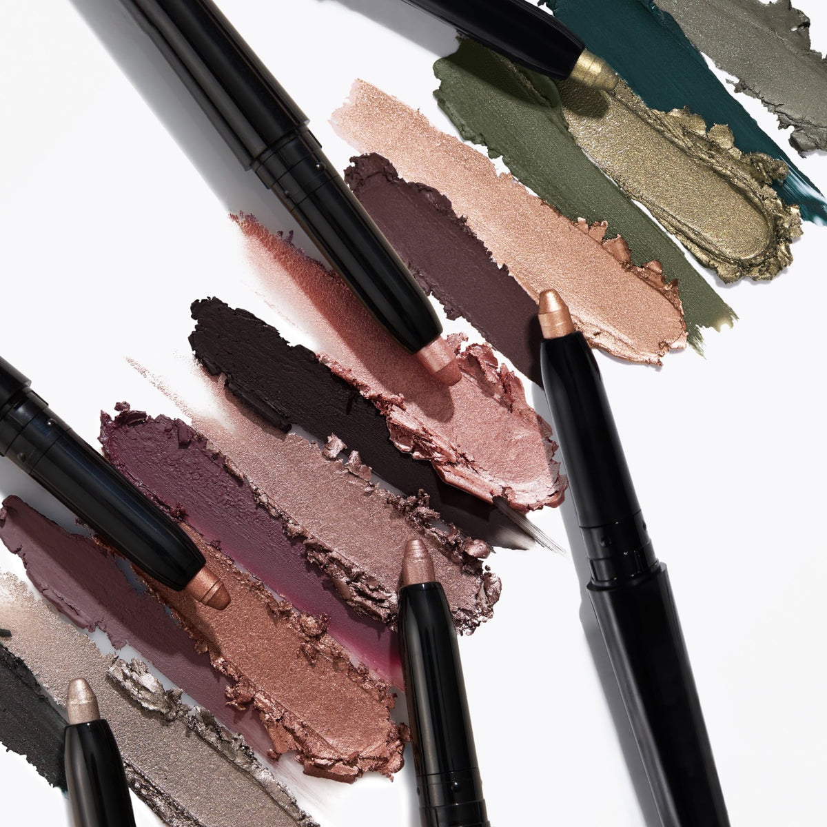 LAURA GELLER swatches on arm showing toasted-brown and chestnut payoff