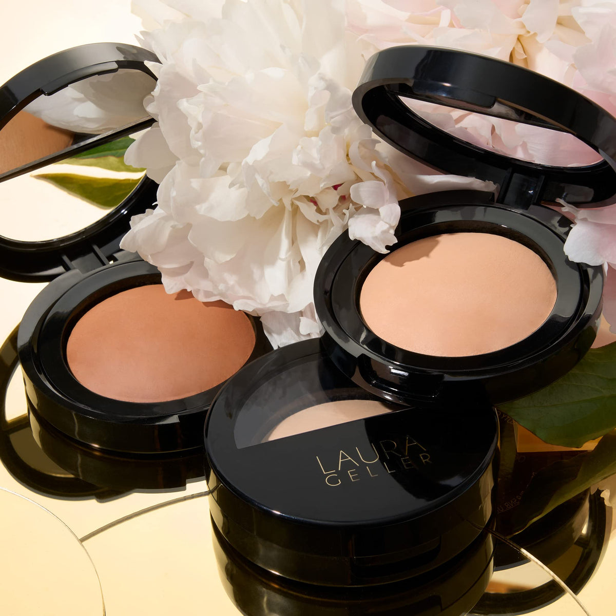 LAURA GELLER close-up of baked powder texture highlighting silky, blendable finish