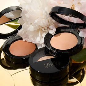 LAURA GELLER close-up of baked powder texture highlighting silky, blendable finish