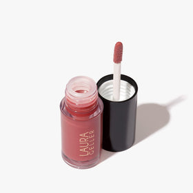 LAURA GELLER NEW YORK size comparison beside common object showing travel-friendly benefit