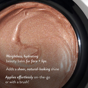 LAURA GELLER NEW YORK close-up cream swirl highlighting smooth texture and melt-in hydration