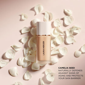 Laura Mercier application with brush illustrating quick blend and even coverage