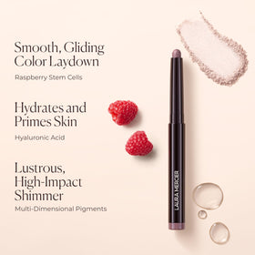 Laura Mercier stick held in hand to show size and travel-friendly scale