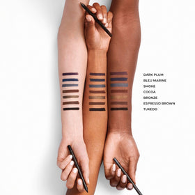 Laura Mercier pencil held in hand to show size and easy control
