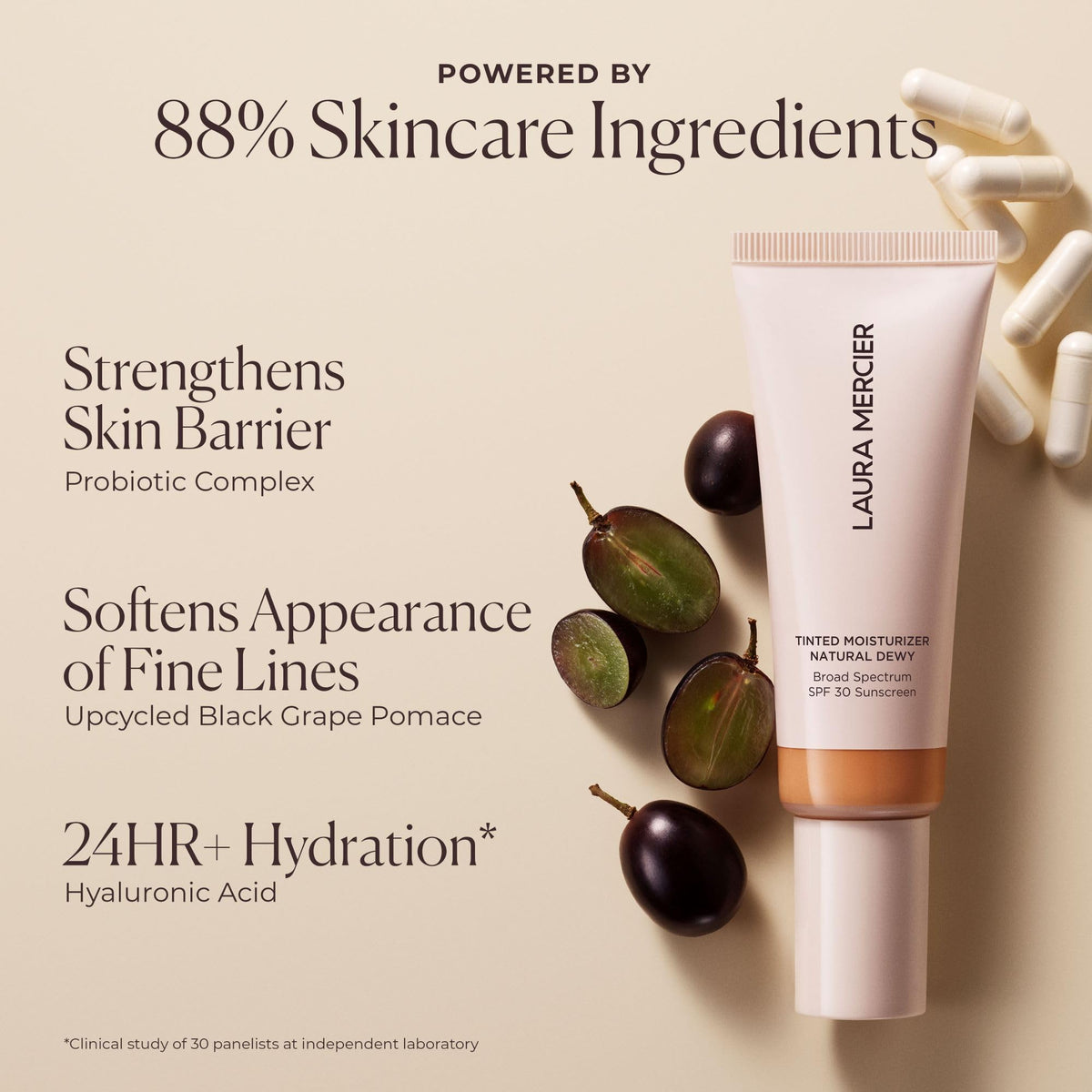 Laura Mercier product beside hand for scale and travel convenience