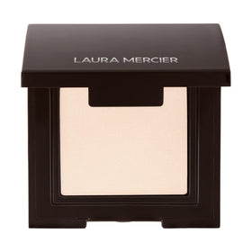 Laura Mercier compact front view showing shade and secure packaging for travel