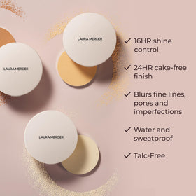 Laura Mercier compact held in hand to show scale and travel-friendly size