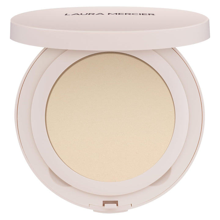 Laura Mercier compact front view showing sleek packaging and easy portability