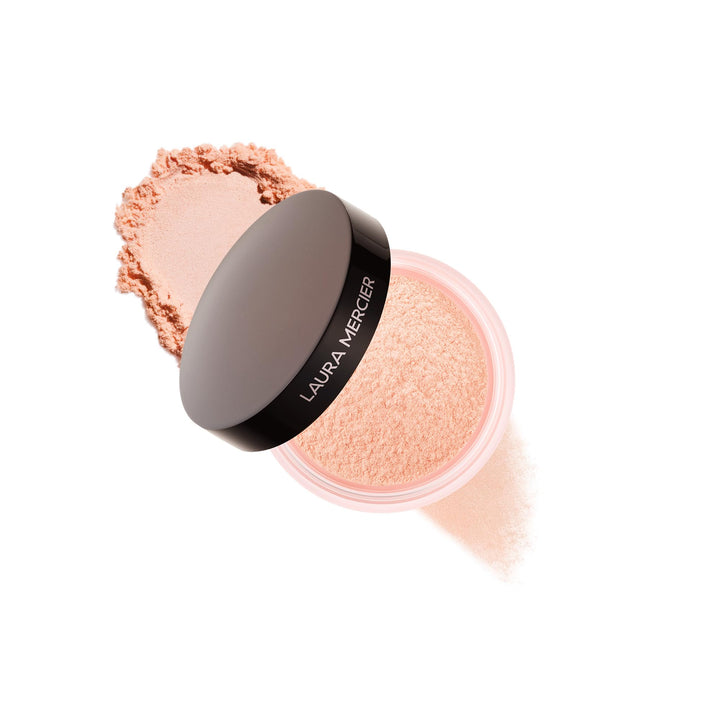 Laura Mercier front jar showing peach powder and sleek packaging benefits brightening