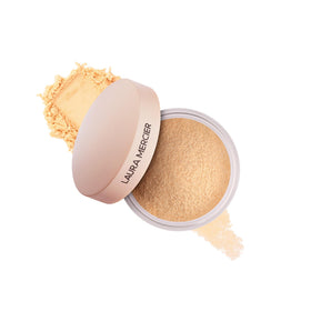 Laura Mercier front packaging showing translucent honey mini and easy portability