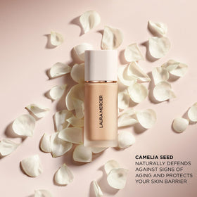 Laura Mercier label close-up showing dermatologist-tested and non-comedogenic benefit