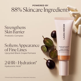 laura mercier mini beside hand to show compact travel-friendly size benefit