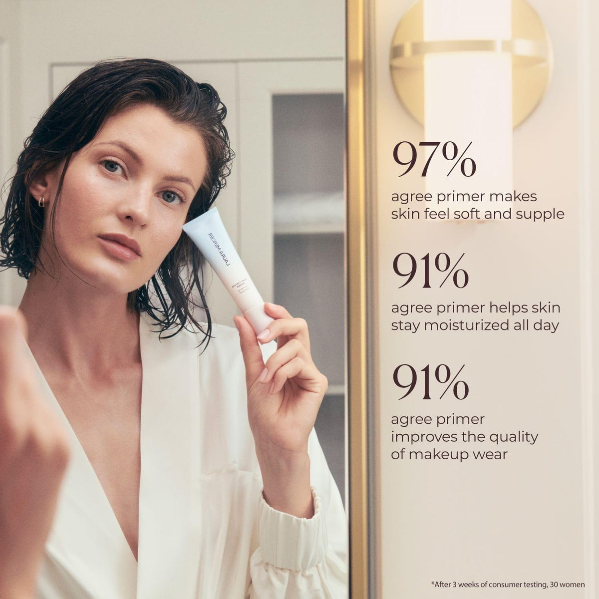Laura Mercier applying primer on skin demonstrating smoother makeup base