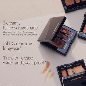 Laura Mercier concealer application brush with product showing precise, targeted application