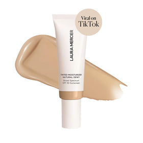 Laura Mercier texture close-up showing creamy dewy consistency, highlights hydrating smooth finish