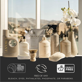 L'AVANT Collective Ambre Santal pouch next to glass dispenser, elegant bathroom benefit