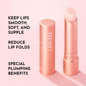 LAWLESS balm in hand to show compact size and travel-friendly benefit
