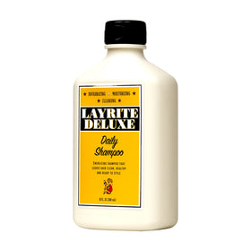 Layrite Daily Shampoo rich lather on hand, demonstrating cleansing power and softening benefit