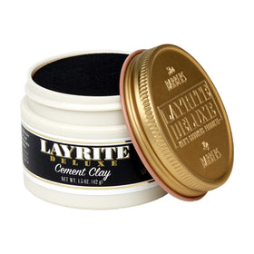 Layrite clay close-up texture on fingers highlighting matte, workable formula