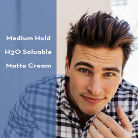 Male model styled hair using Layrite cream for natural matte finish and defined texture
