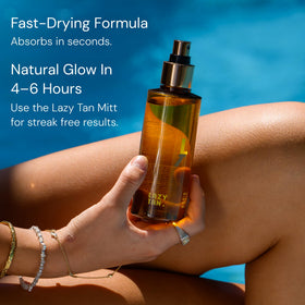 Lazy Tan bottle in hand for scale, emphasises travel-friendly convenience