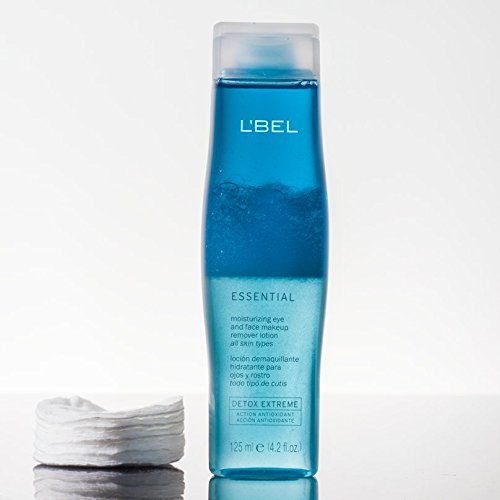 L'Bel lotion on a cotton pad removing waterproof mascara for effortless cleansing