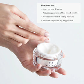 Le Mieux jar beside a hand for scale, conveying 1.75 oz size and travel-friendliness