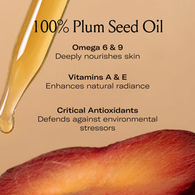 Le Prunier bottle beside fresh plums showing natural ingredients