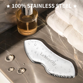 LeMeeOly gua sha held in hand for scale showing compact size and travel convenience benefit