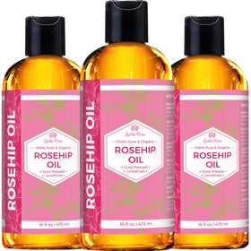 Leven Rose bottle beside hand to show actual 16 oz scale and product value