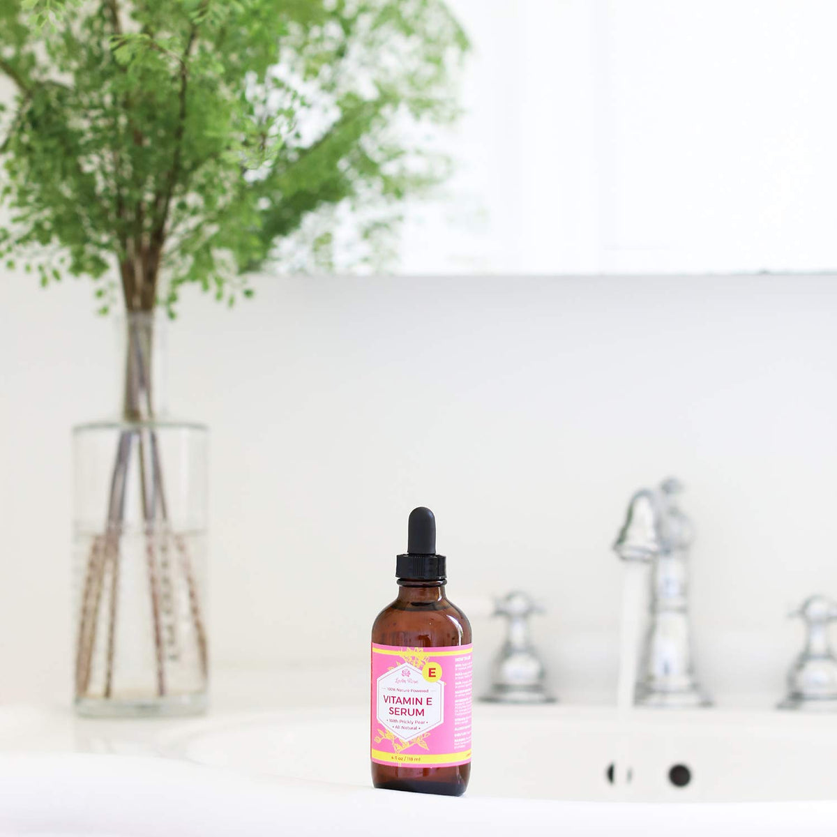 Leven Rose smoothing onto hair ends to boost shine and reduce frizz